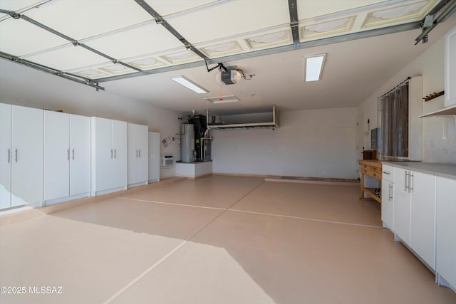 garage with a garage door opener and water heater