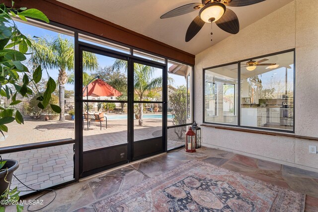 unfurnished sunroom featuring lofted ceiling