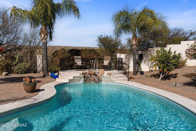 view of swimming pool featuring a mountain view