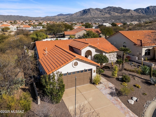 birds eye view of property with a mountain view