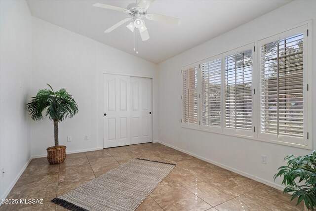 interior space featuring lofted ceiling, a closet, and ceiling fan