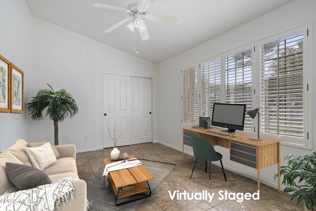 tiled office space with ceiling fan and vaulted ceiling