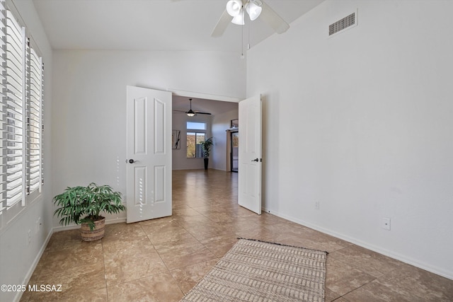 interior space featuring ceiling fan and vaulted ceiling