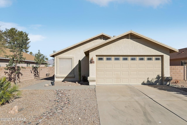 ranch-style home featuring a garage