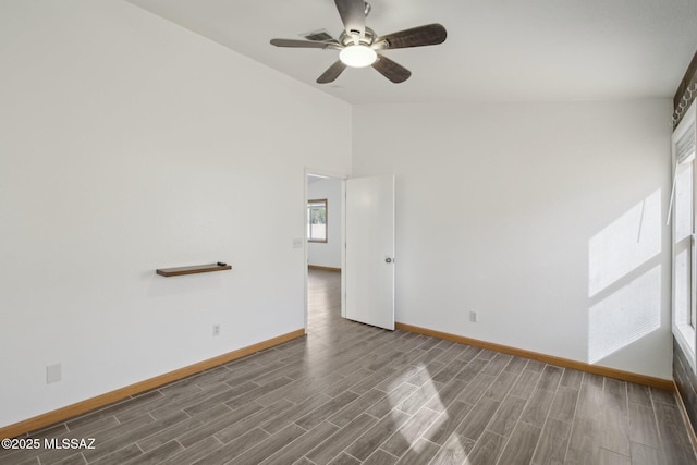 unfurnished room with ceiling fan and dark hardwood / wood-style flooring