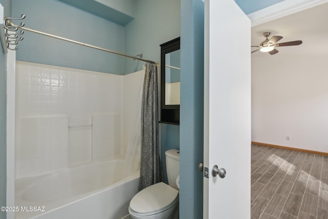 bathroom with ceiling fan, shower / bath combo, and toilet