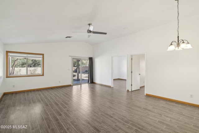 unfurnished room featuring hardwood / wood-style flooring, lofted ceiling, and ceiling fan with notable chandelier