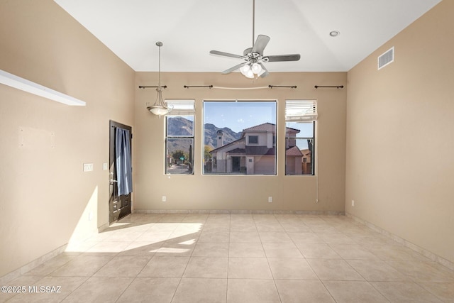 unfurnished living room featuring ceiling fan, light tile patterned flooring, and lofted ceiling