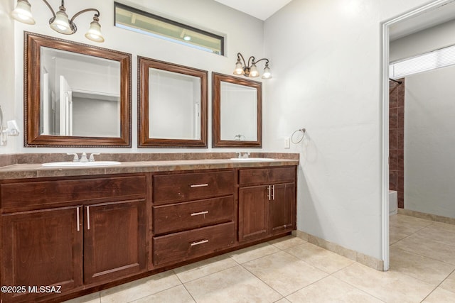 bathroom with shower / tub combination, tile patterned flooring, and vanity