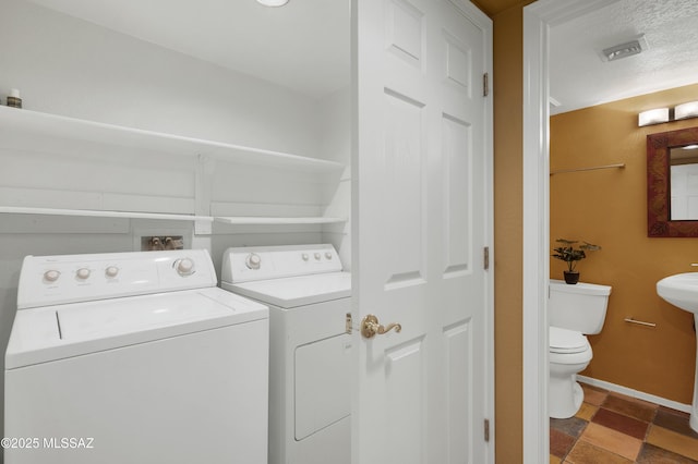 laundry area featuring washer and clothes dryer