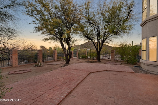 view of patio terrace at dusk