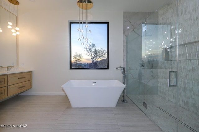 bathroom featuring vanity, independent shower and bath, and tile patterned flooring