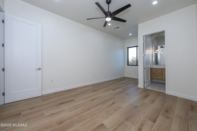 unfurnished bedroom with light hardwood / wood-style floors, ensuite bath, and ceiling fan