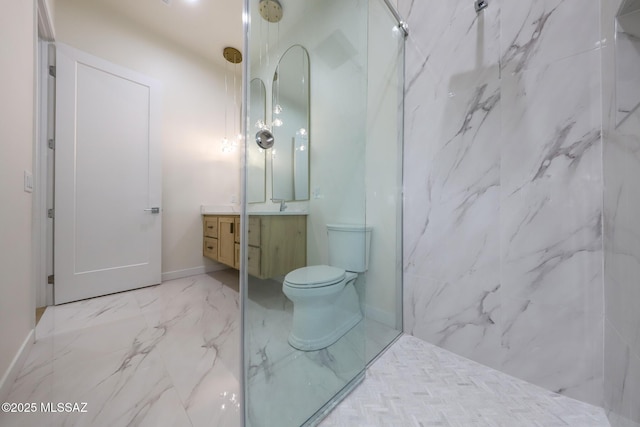 bathroom with vanity, toilet, and a shower