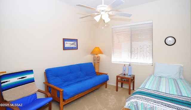 bedroom with a ceiling fan, carpet, and baseboards