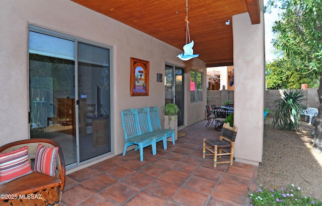 view of patio / terrace featuring outdoor dining space and fence