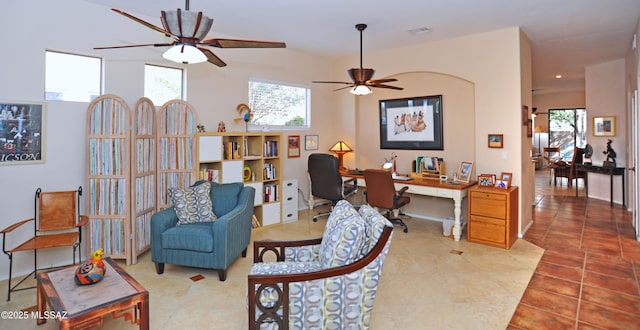 tiled office with a healthy amount of sunlight and ceiling fan