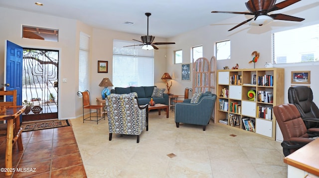 living room featuring light tile patterned floors and ceiling fan