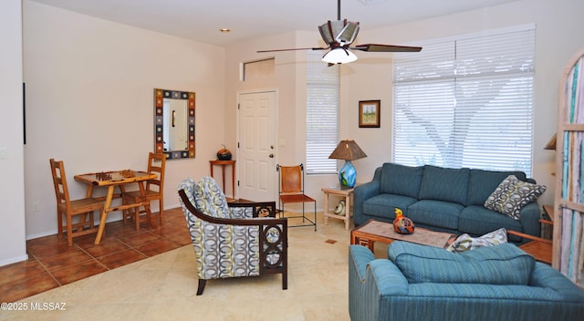 living room with ceiling fan and tile patterned floors