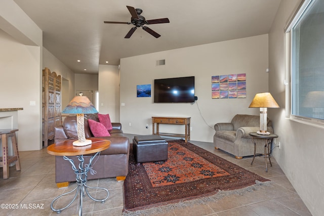 living room featuring a ceiling fan, tile patterned flooring, visible vents, and recessed lighting