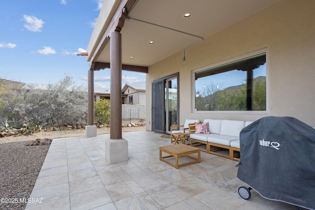 view of patio / terrace with a mountain view, grilling area, and outdoor lounge area