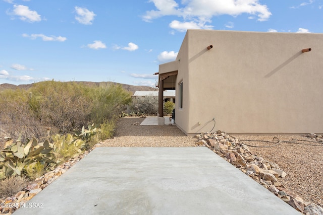 view of property exterior featuring a patio area