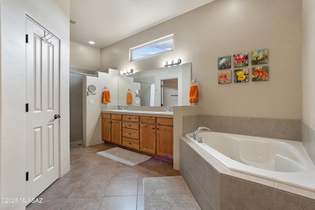 full bathroom with a sink, double vanity, tiled shower, tile patterned flooring, and a garden tub