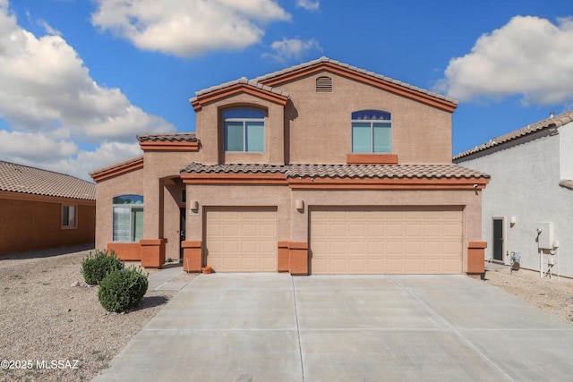 mediterranean / spanish home featuring a garage