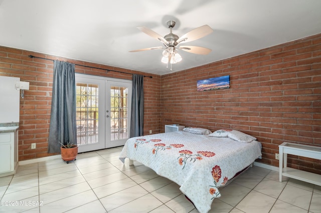 tiled bedroom featuring access to exterior, french doors, ceiling fan, and brick wall