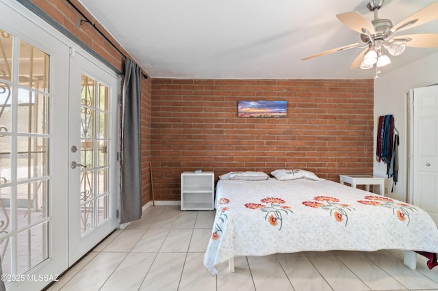 bedroom featuring access to outside, french doors, ceiling fan, and brick wall