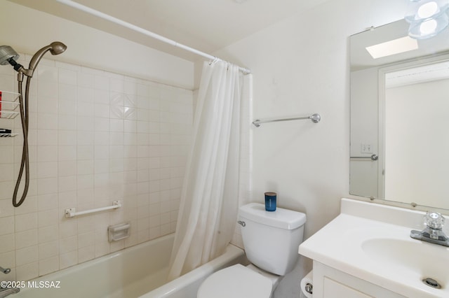 full bathroom with vanity, toilet, and shower / bath combo with shower curtain