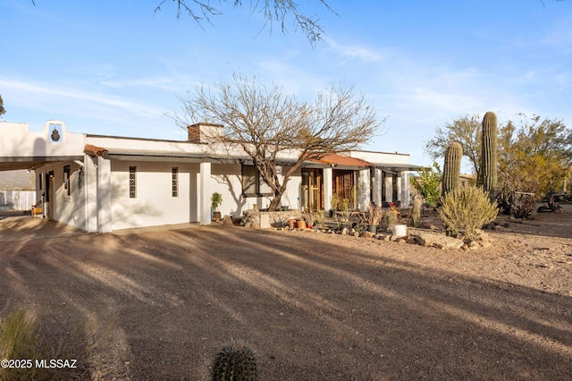 view of front facade with a carport