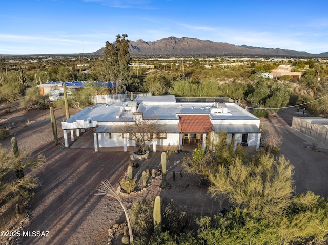 birds eye view of property featuring a mountain view