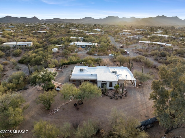 birds eye view of property featuring a mountain view