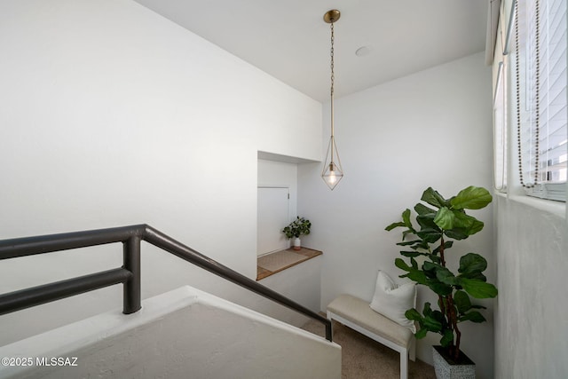 stairs featuring lofted ceiling