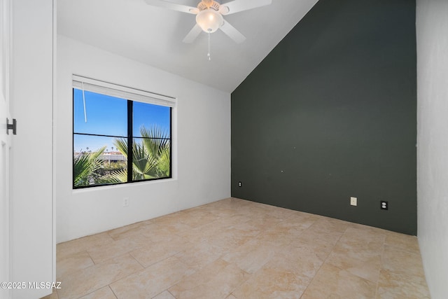 empty room featuring lofted ceiling and ceiling fan