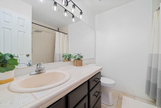 bathroom with vanity, toilet, and walk in shower