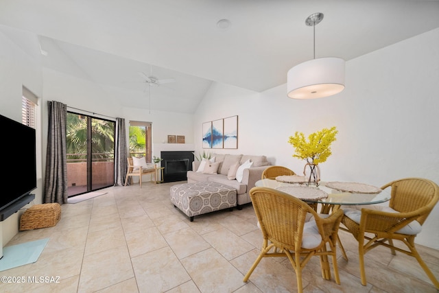 living room featuring light tile patterned flooring, ceiling fan, and high vaulted ceiling