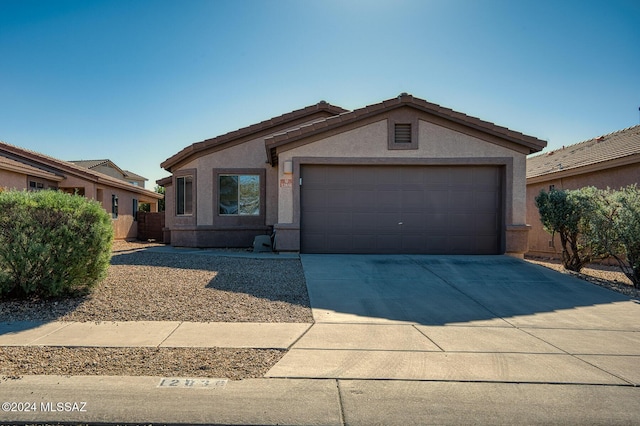 ranch-style home with a garage