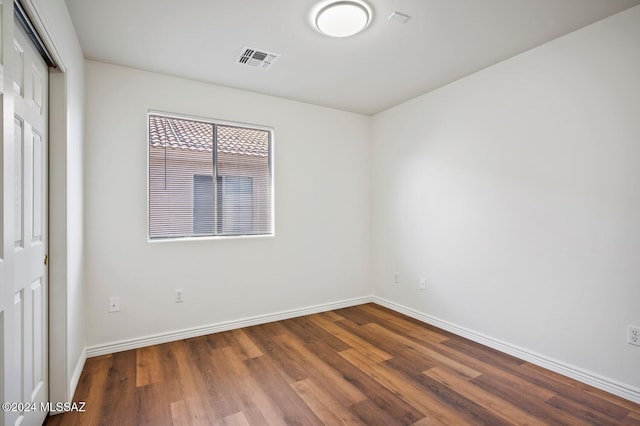 empty room with wood-type flooring