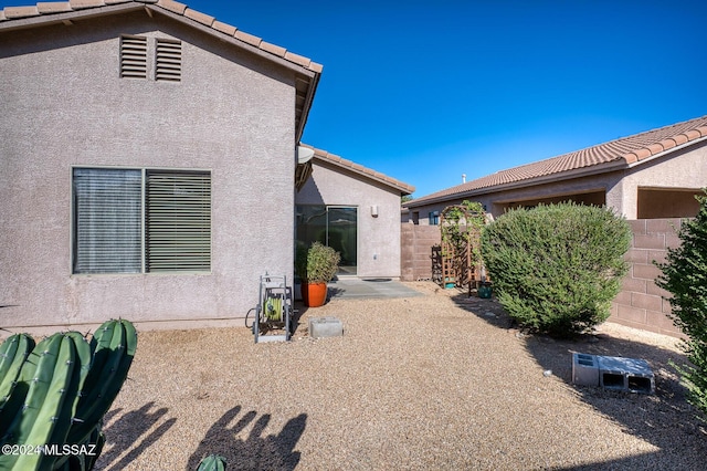 back of property with a patio area