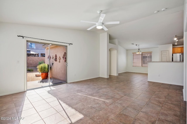 unfurnished living room with lofted ceiling, a healthy amount of sunlight, and ceiling fan