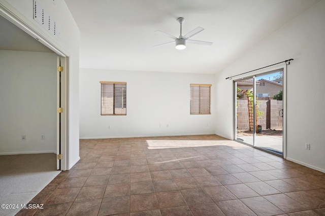 unfurnished room with light tile patterned flooring, ceiling fan, and vaulted ceiling