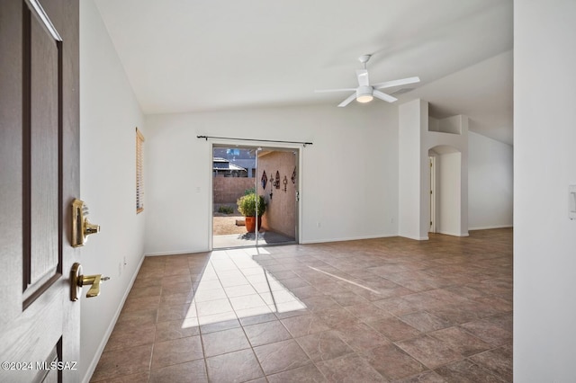 unfurnished room with vaulted ceiling and ceiling fan