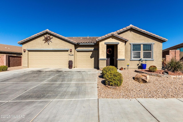 ranch-style home featuring a garage