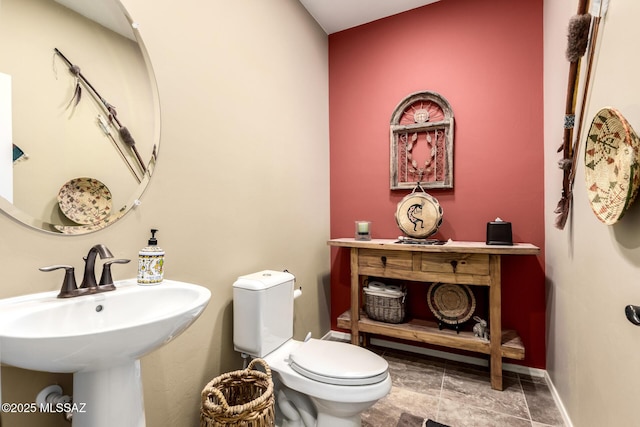 bathroom with sink and toilet