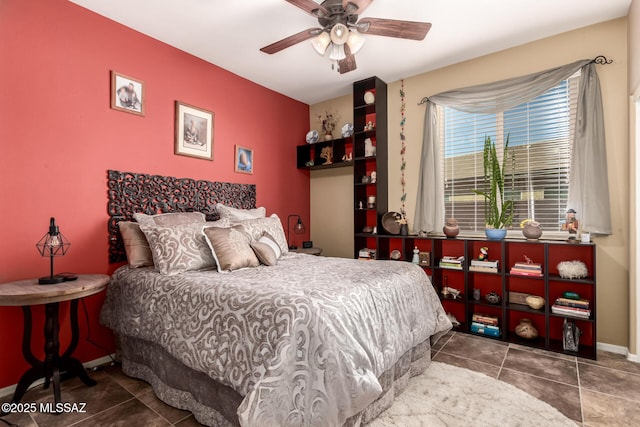 tiled bedroom with ceiling fan