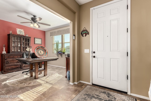 foyer entrance with ceiling fan