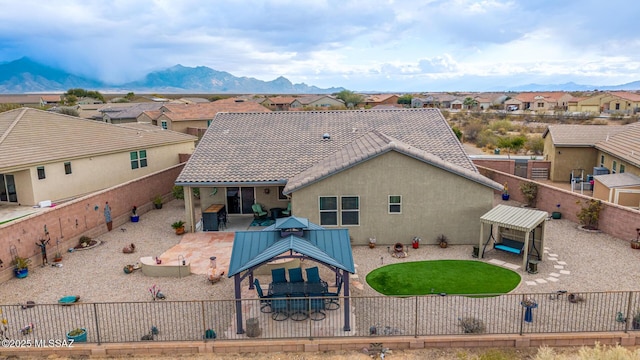 birds eye view of property with a mountain view