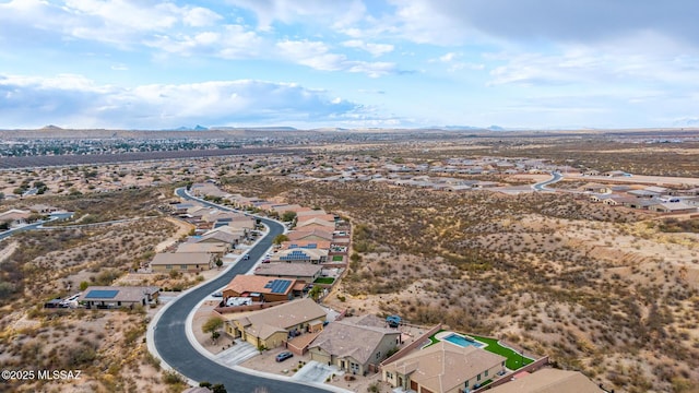 birds eye view of property with a mountain view